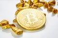 Golden bitcoin coin laying on a heap of golden nuggets, golden ore, is bitcoin new gold these days