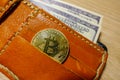 Golden bitcoin coin in the leather wallet Royalty Free Stock Photo