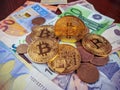 Golden bitcoin coins dominating the global finances and market with more people investing in bitcoin and other cryptocurrencies