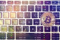 Golden bitcoin on computer keyboard Royalty Free Stock Photo