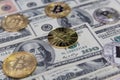 Golden bitcoins on one hundred dollar bills Royalty Free Stock Photo