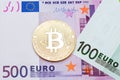 Golden bitcoin on euro backgrouond.