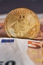 Golden bitcoin on fifty euro banknotes background. Bitcoin crypto currency, Blockchain technology, digital money, Mining concept, Royalty Free Stock Photo