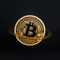 Golden bitcoin flying in the air with Saturn planet ring on black background. Creative cryptocurrency or blockchain concept. Stock