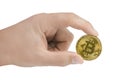 Golden bitcoin in hand isolated on white background