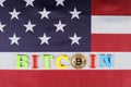 Golden bitcoin, inscription bitcoin on the flag of the United States