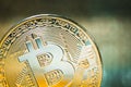 Golden Bitcoin on a luminous background. Close up