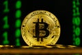 Golden bitcoin macro shot with binary code background Royalty Free Stock Photo