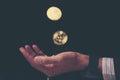 Golden Bitcoin in a man hand, Digitall symbol of a new virtual c Royalty Free Stock Photo
