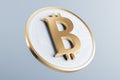 Golden bitcoin sign on light background. Crypto and finance concept.