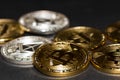 golden bitcoin and silver ether coins from cryptocurrency on black detail