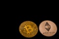 golden bitcoin and silver ether from cryptocurrency on black bottom