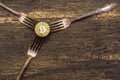 Golden bitcoin and silver forks around Royalty Free Stock Photo