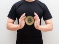 Golden bitcoin at space of man hand middle body on white isolated background Royalty Free Stock Photo