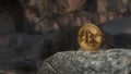 Golden bitcoin standing on stones on dark mountains background. Crypto currency blockchain. For background and commercial use.