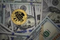 Golden bitcoin on a US dollars. Bitcoin crypto currency on US dollars. Virtual money concept