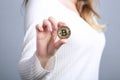 Golden bitcoin in a woman hand, digitall symbol of a virtual cur Royalty Free Stock Photo