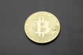 Golden Bitcoins digital virtual money on a black gray background. Royalty Free Stock Photo