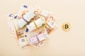 Golden bitcoins with euro banknotes as a background. Virtual crypto currency, digital concept Royalty Free Stock Photo