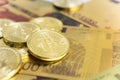 Golden bitcoins on euro banknotes, closee up Royalty Free Stock Photo