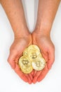Golden bitcoins in Hand - conceptual image for crypto currency - Future currency - White background Royalty Free Stock Photo