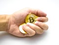 Golden bitcoins in hand. Digital symbol of a new virtual currency on white background. Royalty Free Stock Photo