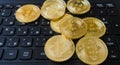 Golden Bitcoins on a laptop keyboard. Cryptocurrency Royalty Free Stock Photo