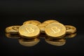 Golden bitcoins reflecting on dark surface, cryptocurrency future concept Royalty Free Stock Photo