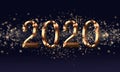 Golden black Christmas or New Year background, inscription 2020 with glitter, snowflakes, stars, bokeh lights on the blue gradient Royalty Free Stock Photo