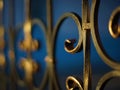 Golden black forged fence with curls, perspective view Royalty Free Stock Photo