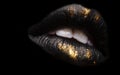 Golden and black lipstick close-up Royalty Free Stock Photo