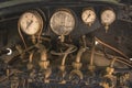 Golden and black Pressure gauge and Feed water pump valves of an Royalty Free Stock Photo