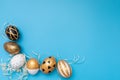 Golden, black, white easter eggs on blue background. Geometry. Minimal easter concept. View from above. Easter card with copy Royalty Free Stock Photo