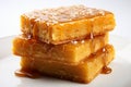 Golden blondies, sweet and buttery, on a clean, bright white background