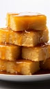 Golden blondies, sweet and buttery, on a clean, bright white background