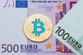 Golden blue bitcoin on euro backgrouond.