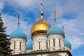 Golden and blue domes of an Orthodox church on a background of blue sky with white clouds Royalty Free Stock Photo