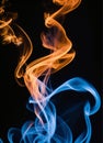 Golden and blue smoke on black background abstract Royalty Free Stock Photo