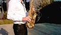 Golden Blues. Boys Band saxophone section at event , jazz player male playing on Saxophone, music instrument played by man saxopho Royalty Free Stock Photo