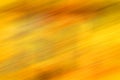 Golden blurred grunge background in yellow fall autumn colors- perfect background with space for text or image