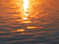 blurred sunlight reflected on water surface at river for nature abstract background. Royalty Free Stock Photo