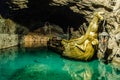 Golden boat in an underground lake