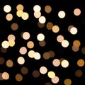 Golden bokeh on a dark background. Defocused bokeh lignts. Abstract Christmas background. Abstract circular bokeh background of Ch Royalty Free Stock Photo