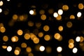 Golden bokeh lights. Black background