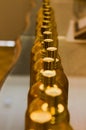 Golden bottles in a row, perspective shot from above