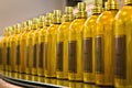 Golden bottles in a row, perspective shot