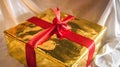 Golden box of present with red ribbon Royalty Free Stock Photo