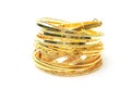 Golden bracelets and golden jewelry, isolated Royalty Free Stock Photo