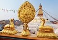 Golden brahma symbol in front of Bodhnath stupa Royalty Free Stock Photo