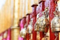 Golden brass bell hanging on the temple fence Royalty Free Stock Photo